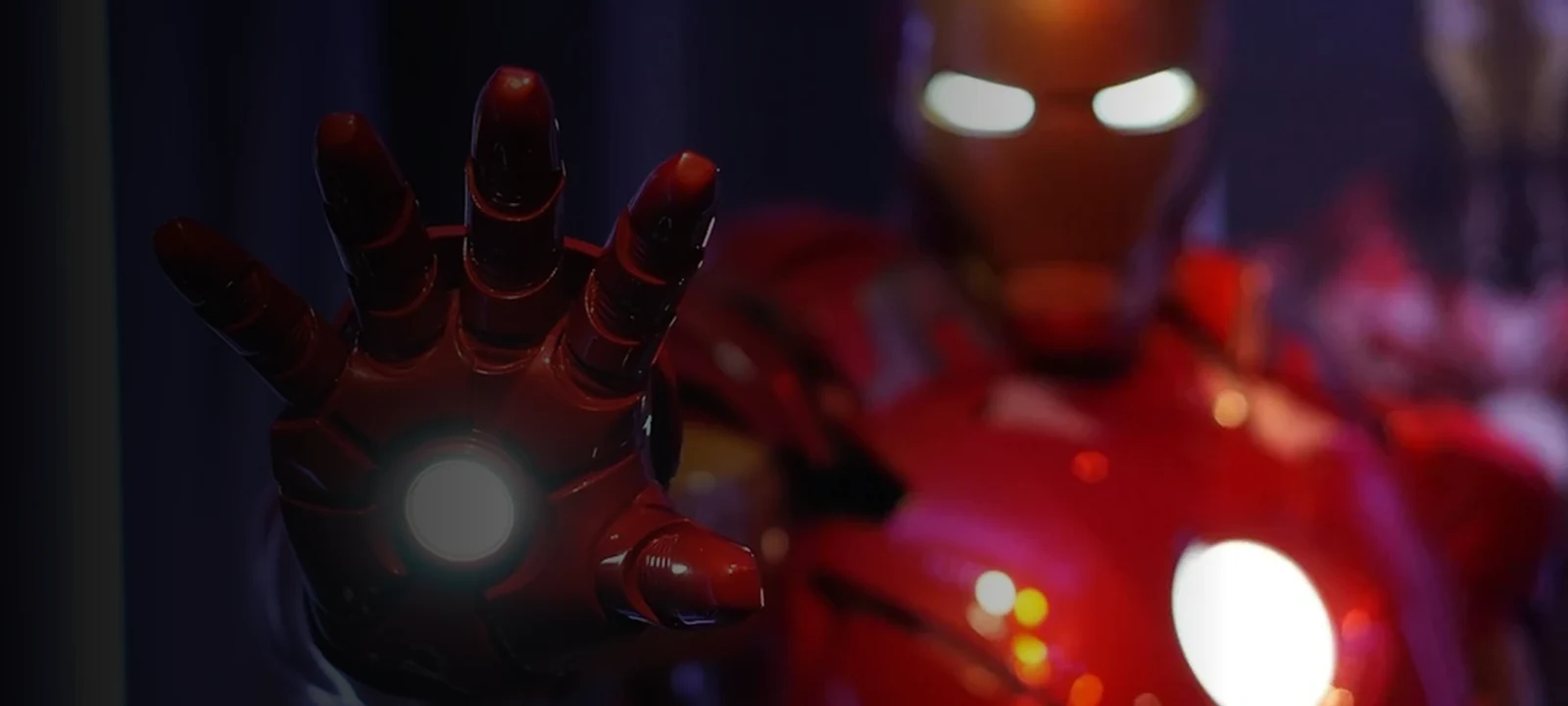 Iron Man in red and gold armour with an illuminated repulsor